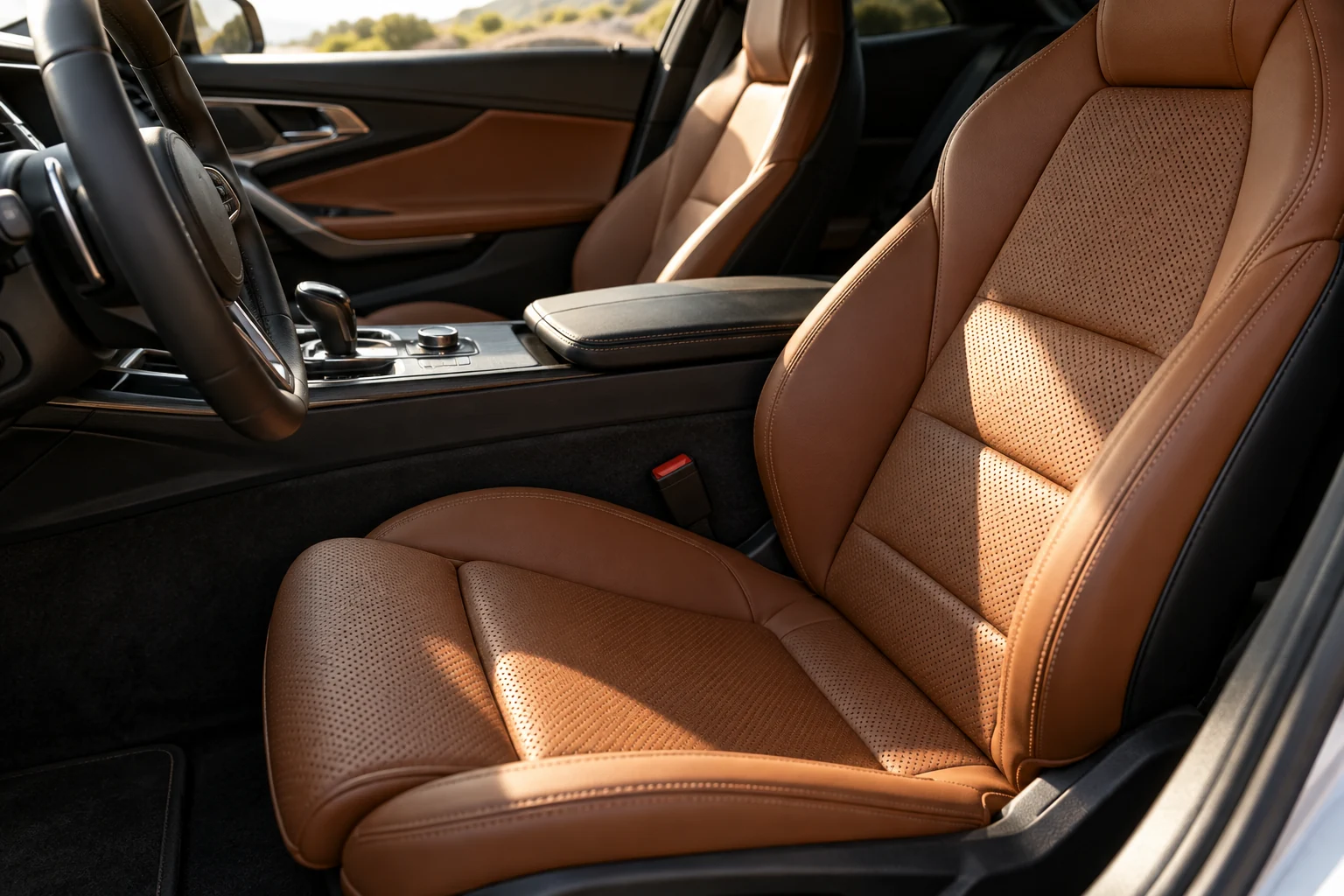Carefully detailed cognac leather and dark trim in a premium car interior